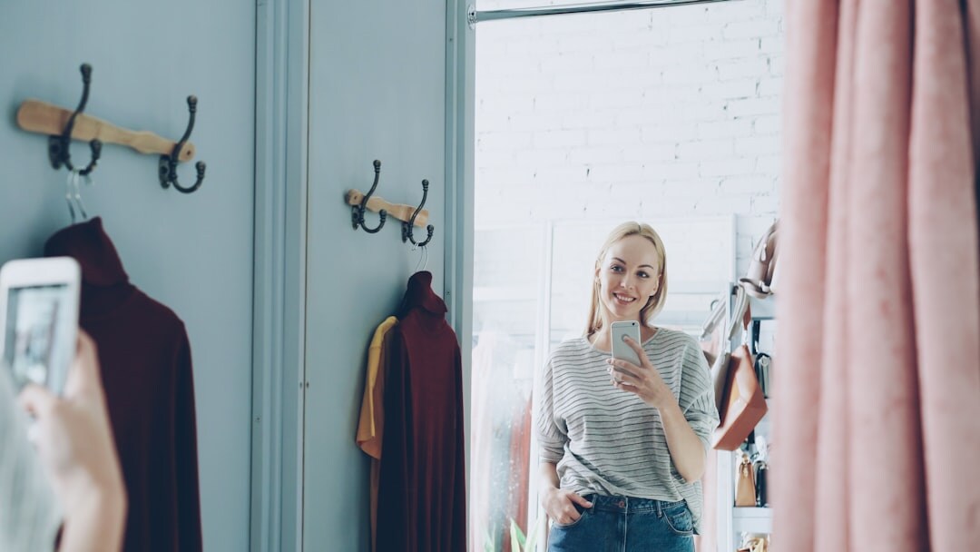 store owner checking smartphone