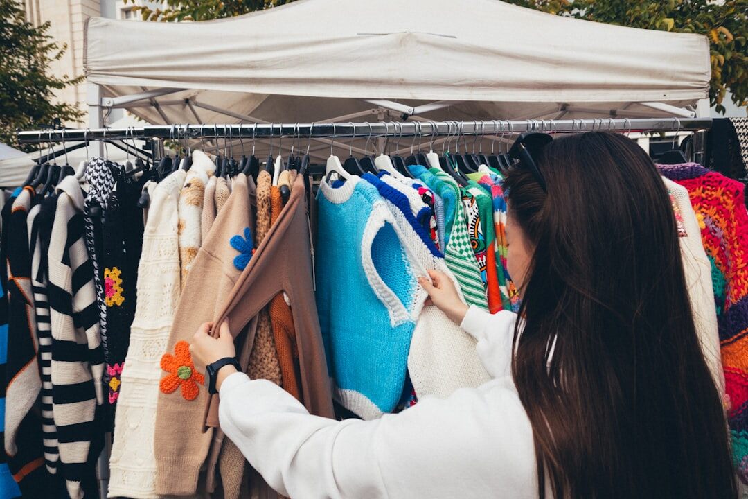 woman browsing boutique clothing rack