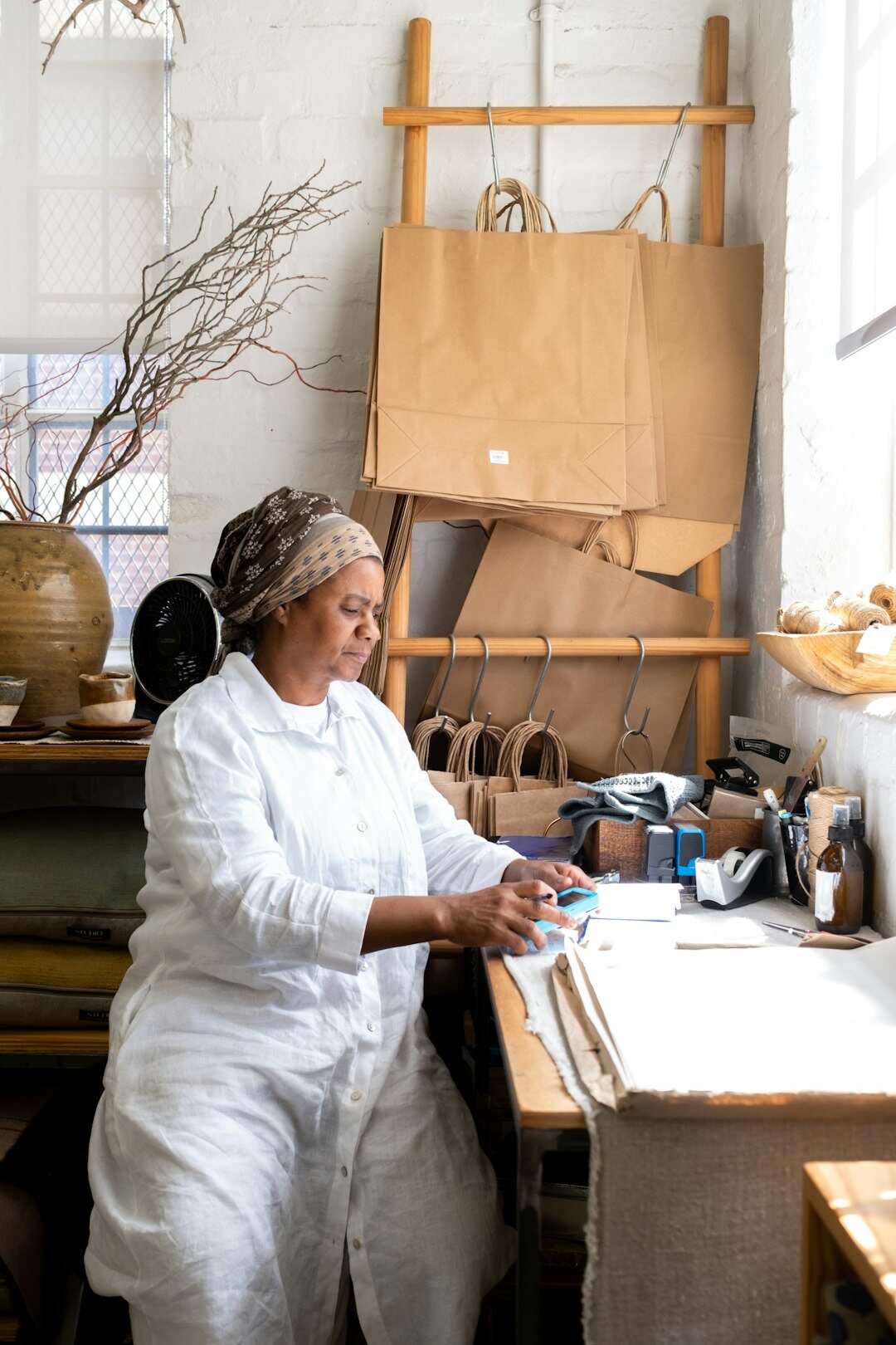 boutique owner arranging products
